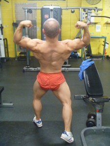 Back double biceps in the gym. Practise posing in the gym is important for enhancing that 'muscle-mind connection'. Vital for growth and progress. Increases your awareness of yourself. 