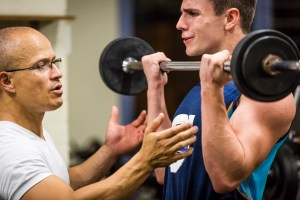 Loading the 'guns' with proper execution. Here Brad is building his 'mind-muscle' connection under my watchful eye.